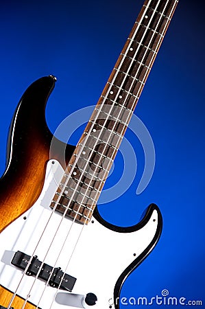 Sunburst Bass Guitar Isolated On Blue