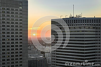 Sundown over Warsaw city with modern buildings
