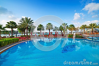 Sunrise at the tropical swimming pool