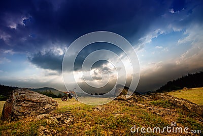 Sunset landscape with dirt bike