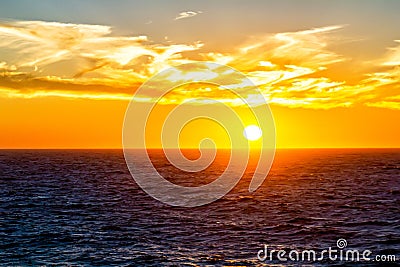 Sunset over horizon at ocean