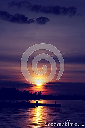 Sunset Over a Lake with Couple - Vertical