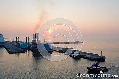  sunset over port of Puerto Quetzal, tug boat in foreground, Guatemala