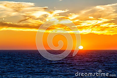 Sunset over sea water