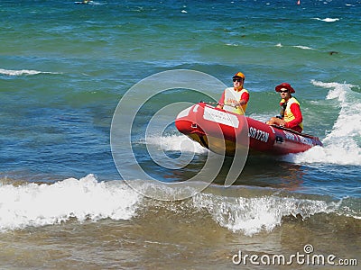 Surf rescue boat with men in action