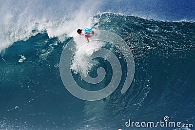 Surfer Julian Wilson Surfing Pipeline in Hawaii