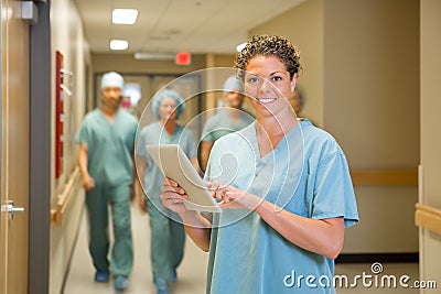 Surgeon Holding Digital Tablet In Hospital