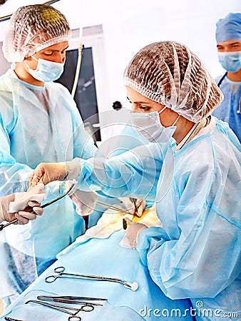 Surgeon at work in operating room.