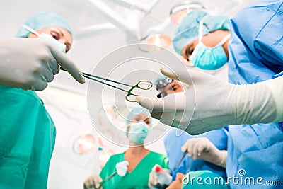 Surgeons in operating room in emergency