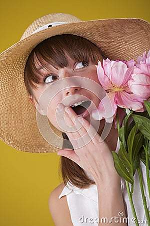 Surprised woman in summer hat