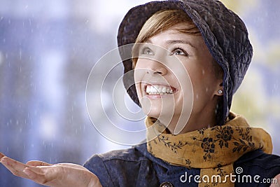 Surprised young woman in rain