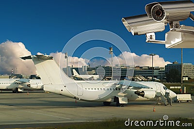 Surveillance video camera, airplanes, airport.