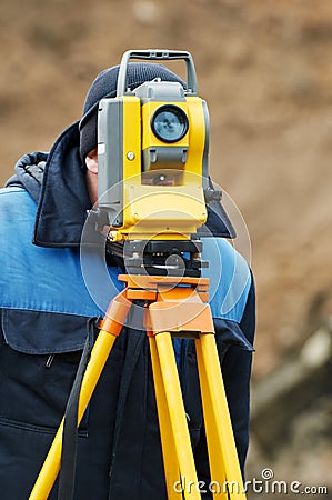 Surveyor works with theodolite