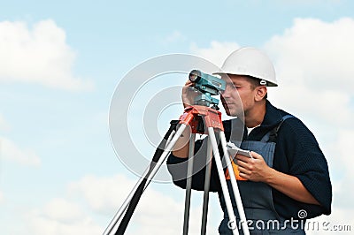 Surveyor works with theodolite