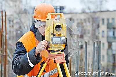 Surveyor works with theodolite