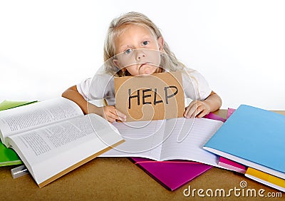 Sweet little school girl holding help sign in stress with books and homework