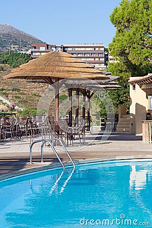 Swimming pool and bar with umbrellas