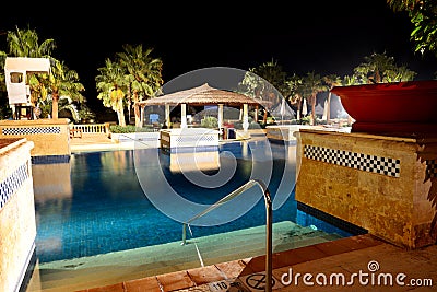 Swimming pool in night illumination at the luxury hotel