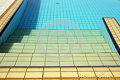 Swimming pool stairs, water & tiles