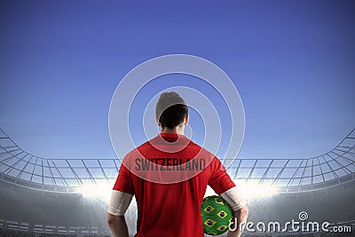 Swiss football player holding ball