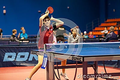 Table tennis game between girls