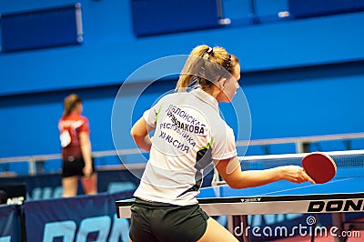 Table tennis game between girls