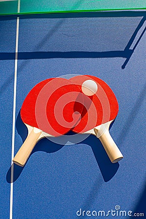 Table tennis ping pong two paddles and white ball