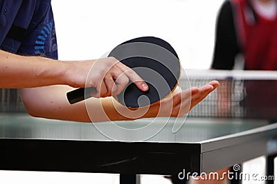 Table tennis player serving