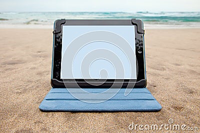 Tablet device on beach