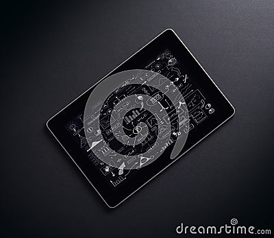 A tablet pc with icons over the black background