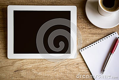 Tablet on wooden table