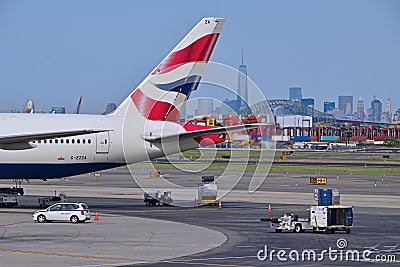 Tail of British Airways plane with New York City in the background