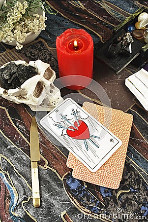 Tarot cards with burning candle