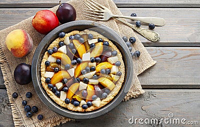 Tart with peach, pumpkin, plum, pear and blueberry in autumn set