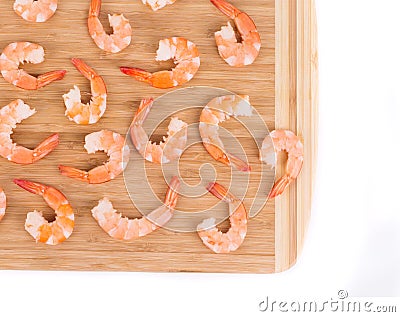 Tasty boiled shrimps on cutting board.