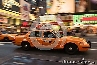 Taxi cab speeding through city