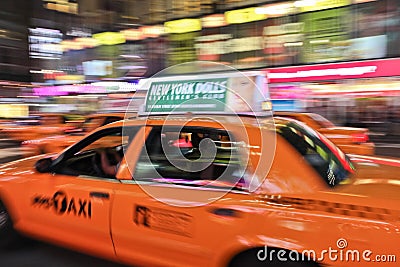 Taxi cab speeding through city