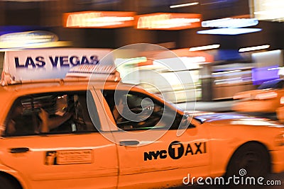 Taxi cab speeding through city