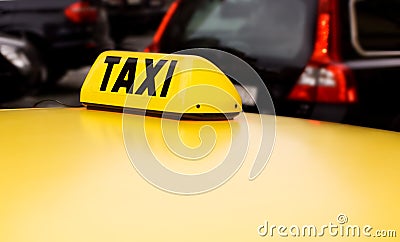 Taxi sign yellow