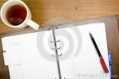 Tea cup with notebook