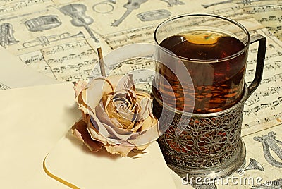 Tea and rose at vintage background