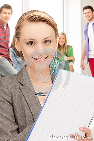 Teacher with big notepad at school