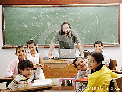 Teacher in classroom with his little student