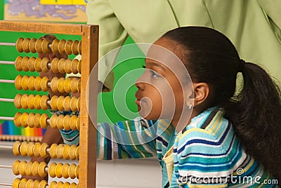 A teacher showing how to use a abacus