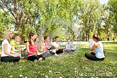 Teacher with students in park