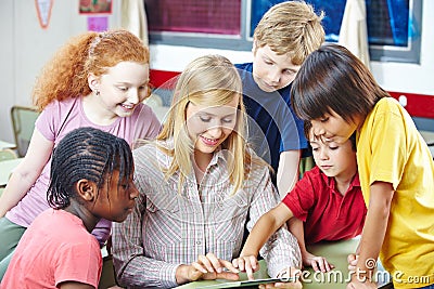 Teacher and students with tablet computer