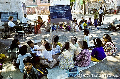 Teacher teaches children in india