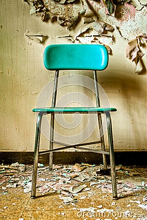 Teal Chair in Abandoned Building