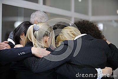 Team building event: group hug in office