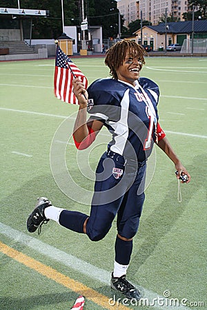 Team USA Football Player Poses with American Flag